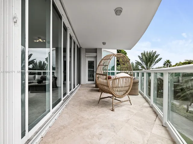 a view of a chairs and tables in the balcony