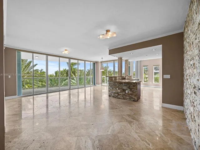 a room with furniture and a large window