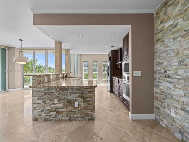 a room with fireplace and chandelier