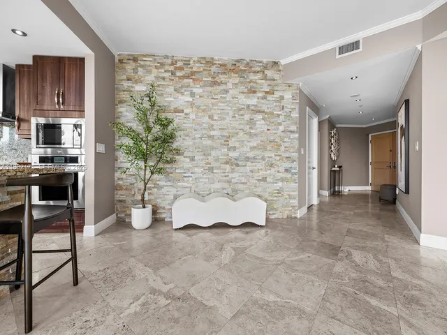 a view of a livingroom with furniture and an empty room