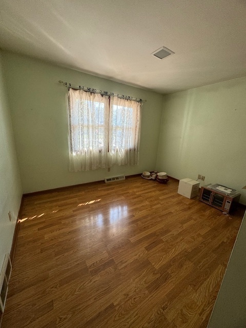 1518 Sharon Road Streator, IL 61364 - Photo 14 of 37 a view of room with window and hardwood floor