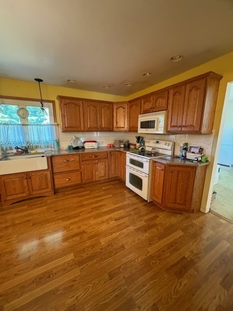 1518 Sharon Road Streator, IL 61364 - Photo 10 of 37 a kitchen with stainless steel appliances granite countertop a stove a sink and a refrigerator
