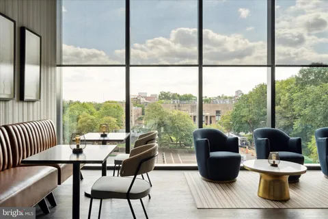 a dining area with a table and chairs