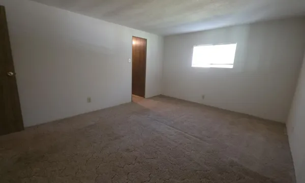a bathroom with a toilet a sink and shower