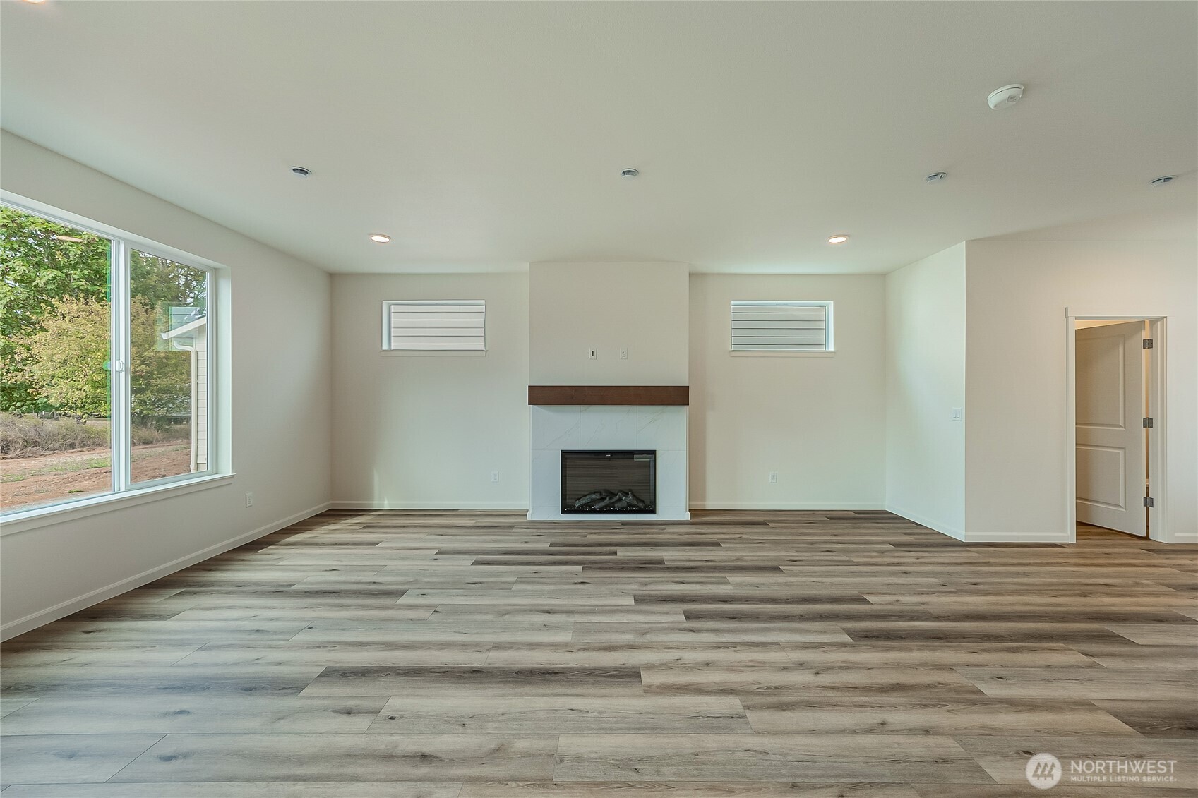 960 RW Fletcher Street Winlock, WA 98596 - Photo 15 of 40 a view of empty room with window and fireplace