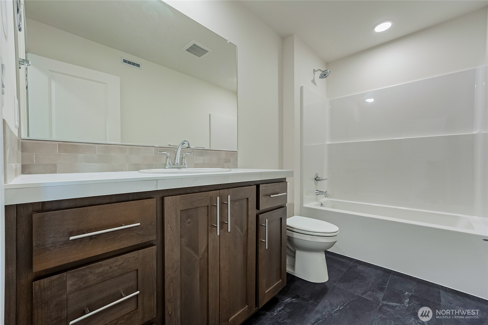 960 RW Fletcher Street Winlock, WA 98596 - Photo 33 of 40 a bathroom with a sink a toilet a mirror and shower