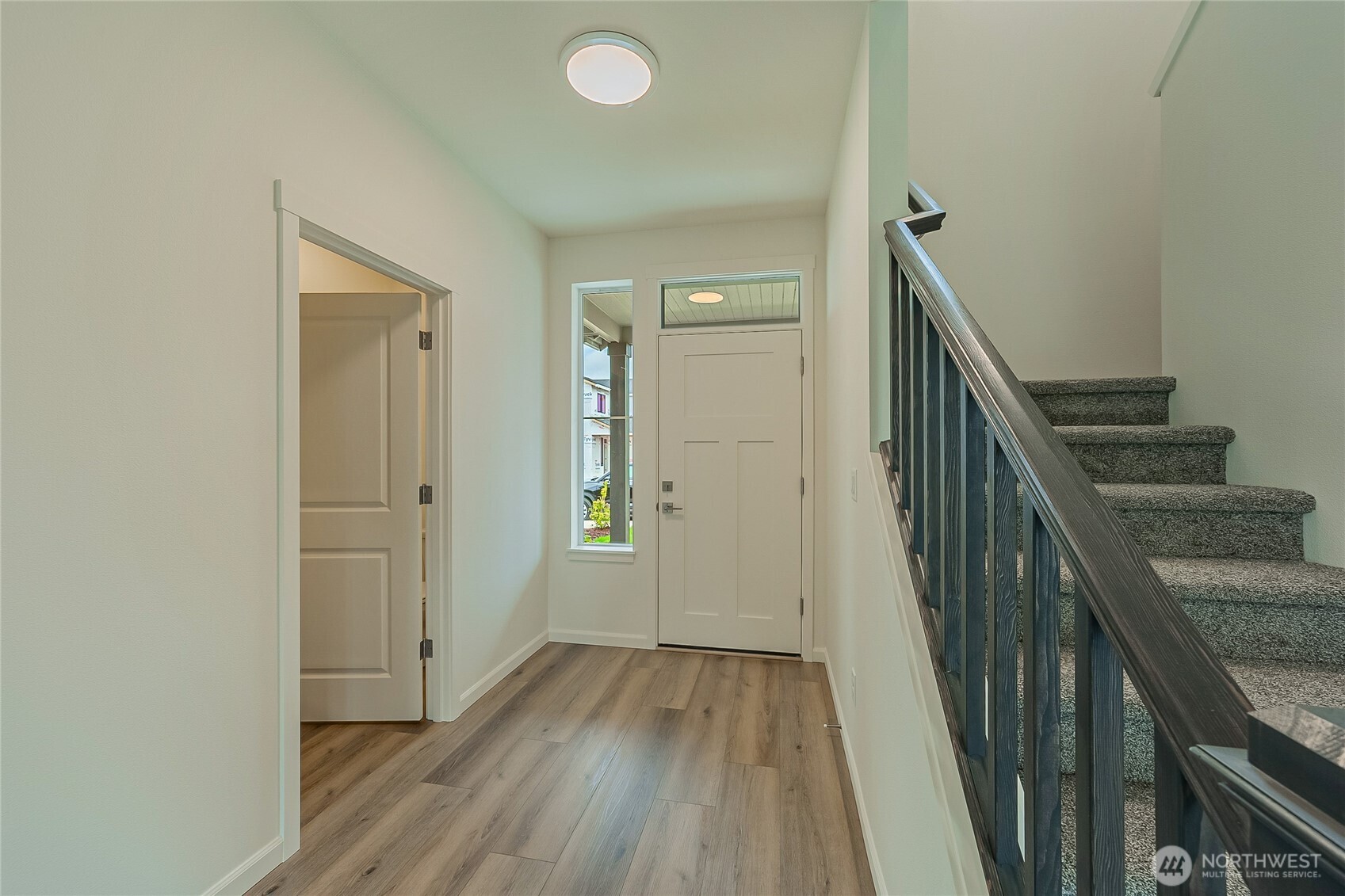 960 RW Fletcher Street Winlock, WA 98596 - Photo 4 of 40 a view of a hallway with wooden floor and entryway