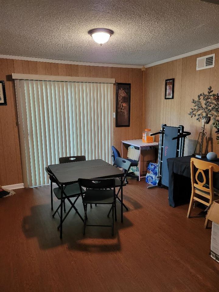 4039 Hobson Road Memphis, TN 38128 - Photo 2 of 9 a view of a workspace with furniture and a window