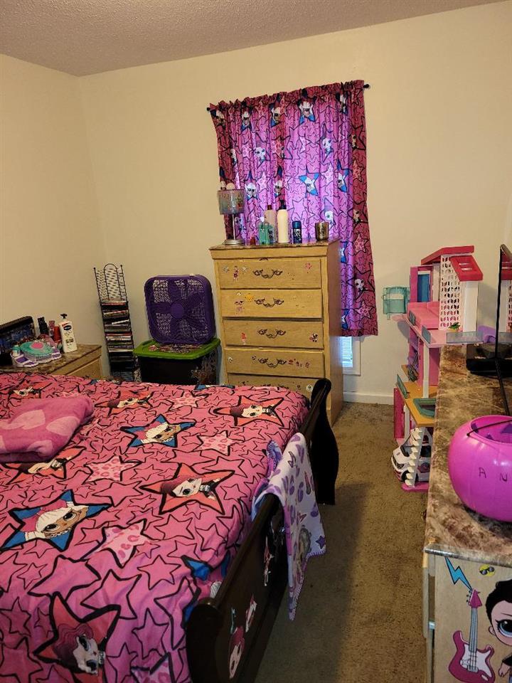 4039 Hobson Road Memphis, TN 38128 - Photo 7 of 9 a bedroom with a bed and dresser