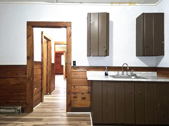 a bathroom with a sink a mirror and a shower