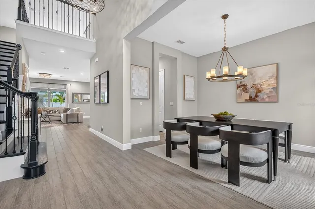 a kitchen with a faucet a chandelier