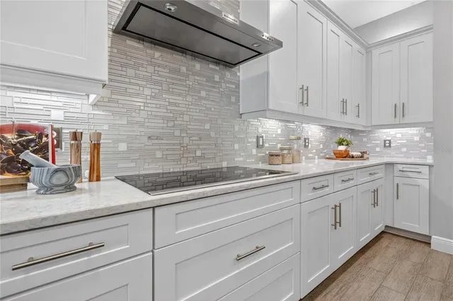 a view of walk in closet with clothes