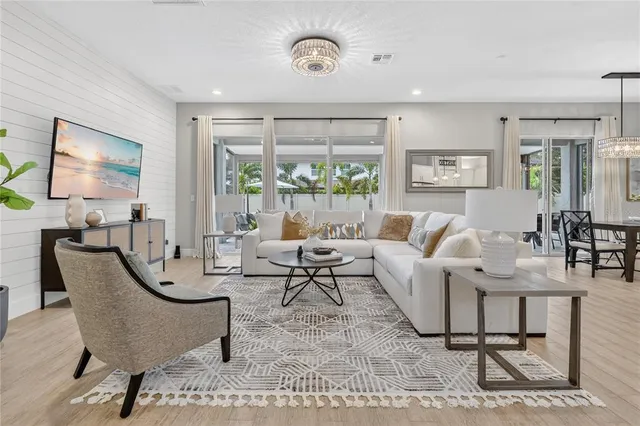 a view of an empty room with a cabinet and a window