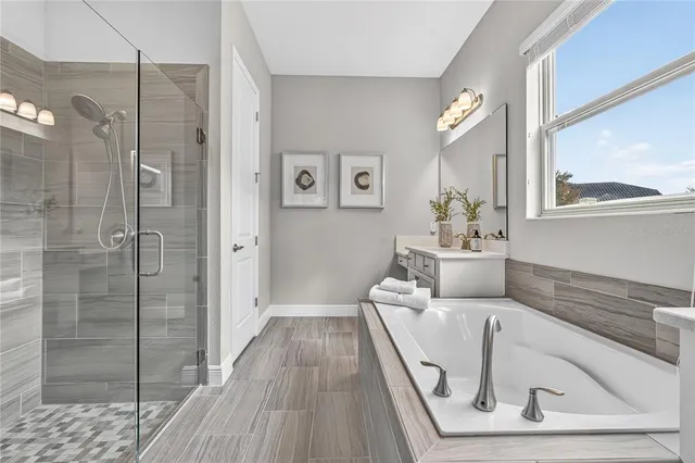 a view of a patio with table and chairs with wooden floor and fence