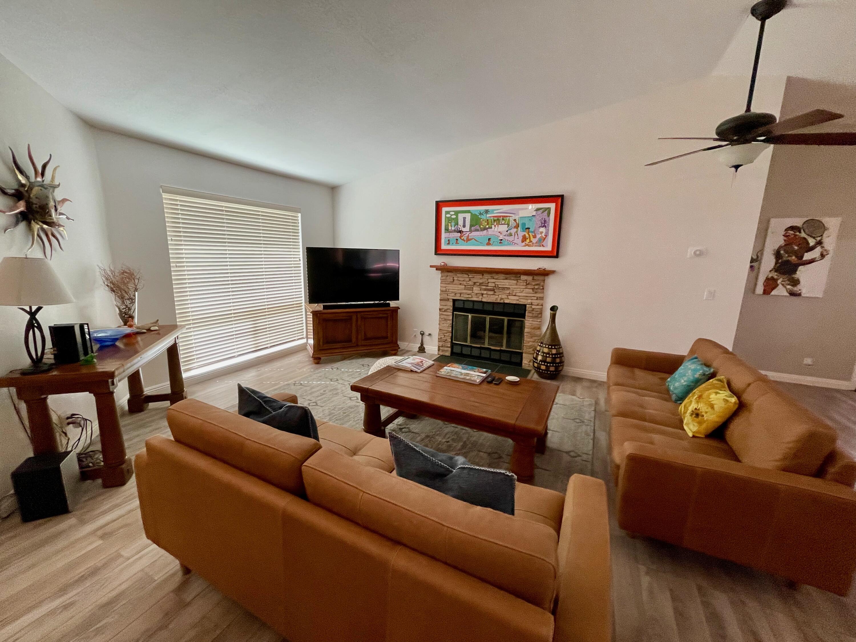 43622 Warner Trail Palm Desert, CA 92211 - Photo 11 of 51 a living room with furniture and a flat screen tv