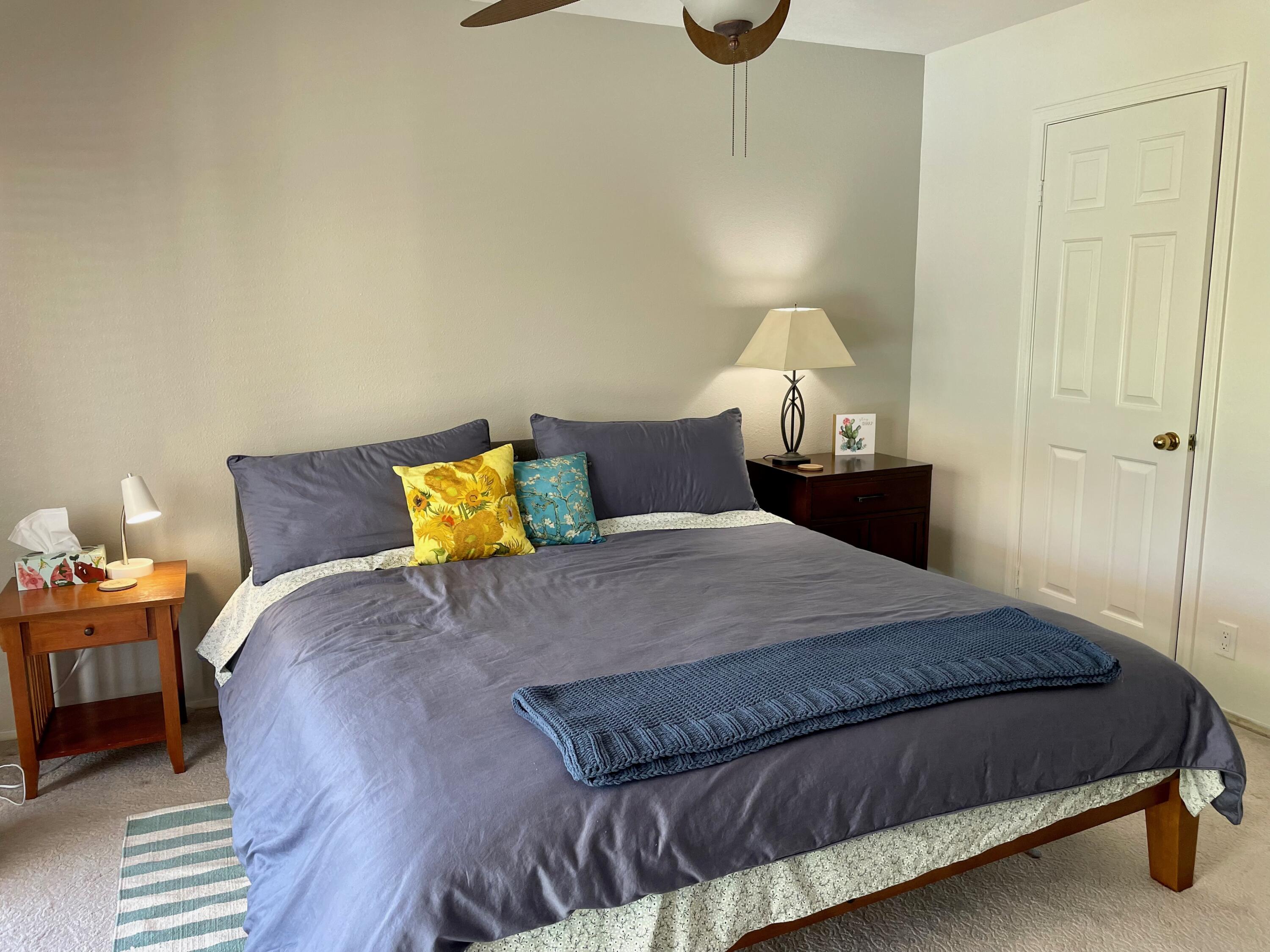 43622 Warner Trail Palm Desert, CA 92211 - Photo 20 of 51 a bedroom with a bed and a lamp on dresser