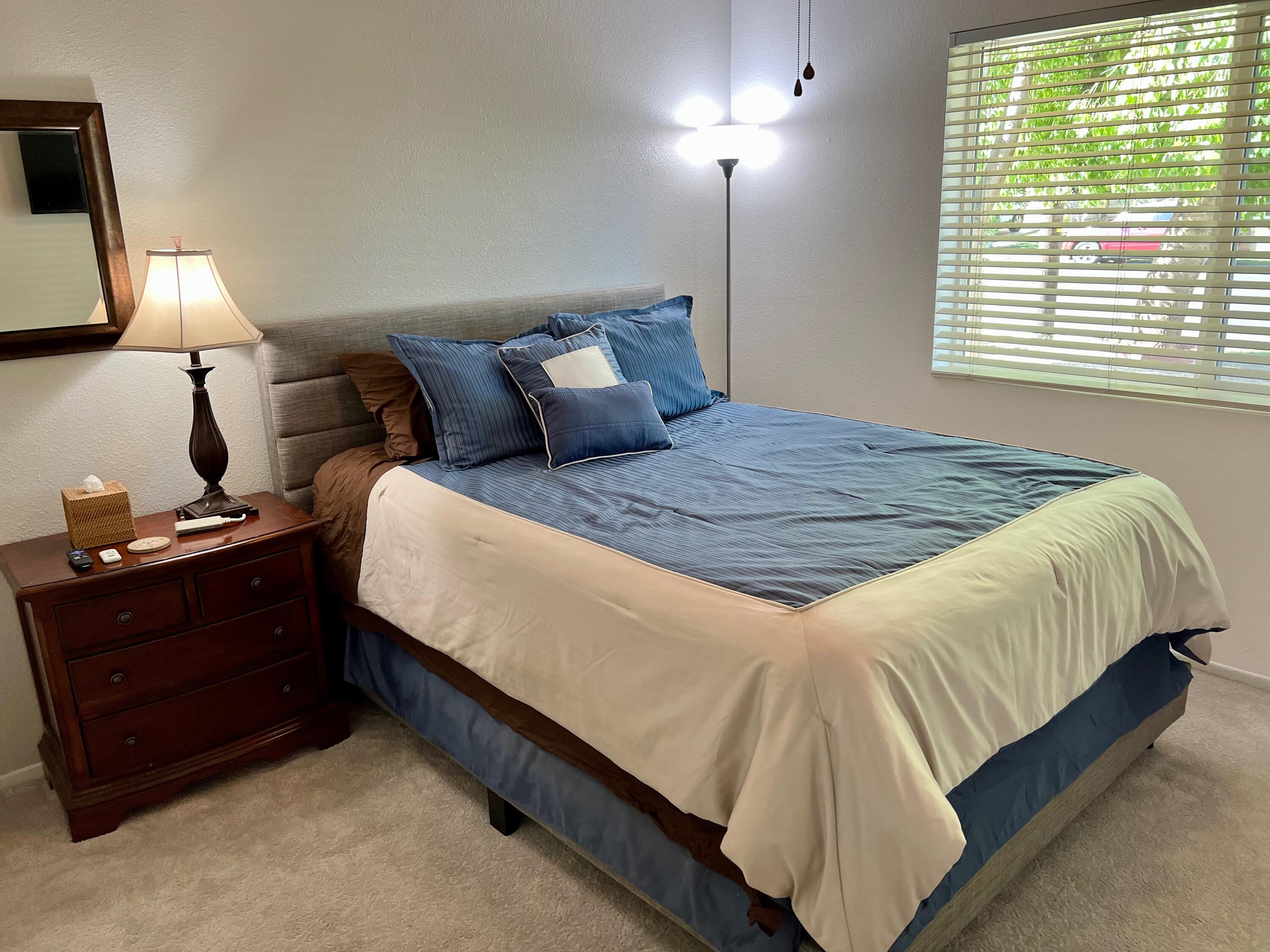 43622 Warner Trail Palm Desert, CA 92211 - Photo 22 of 51 a bed sitting in a bedroom next to a window