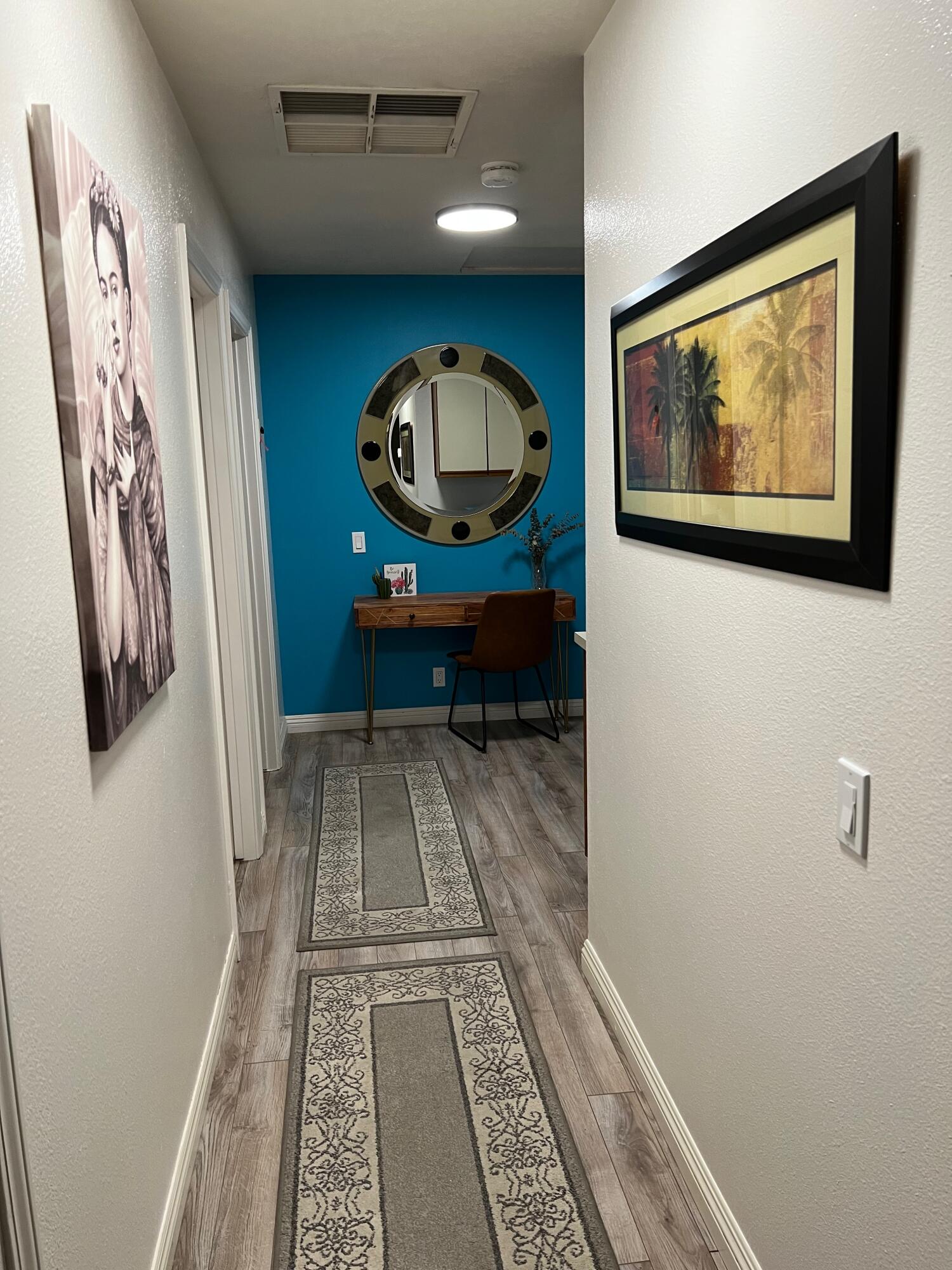 43622 Warner Trail Palm Desert, CA 92211 - Photo 26 of 51 wooden floor with a rug and a painting on the wall