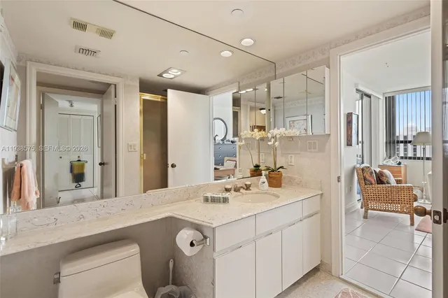 a bathroom with a sink double vanity and a mirror