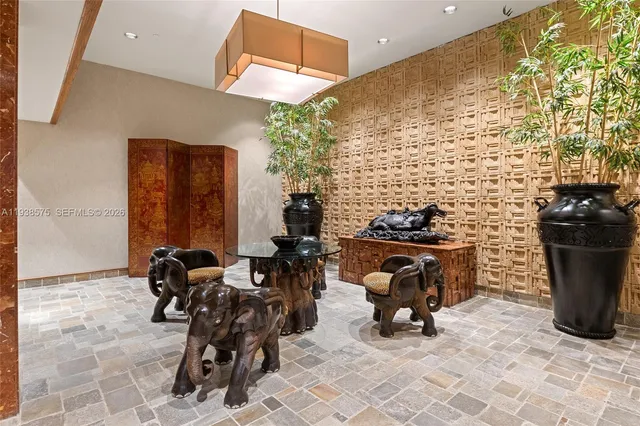 a view of a patio with table and chairs