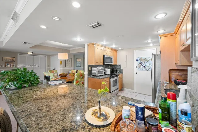 a lobby with furniture and a potted plant