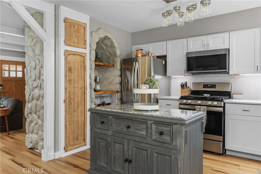 4913 Sparrow Hawk Lane Paso Robles, CA 93446 - Photo 14 of 33 a kitchen with stainless steel appliances granite countertop a sink and a stove