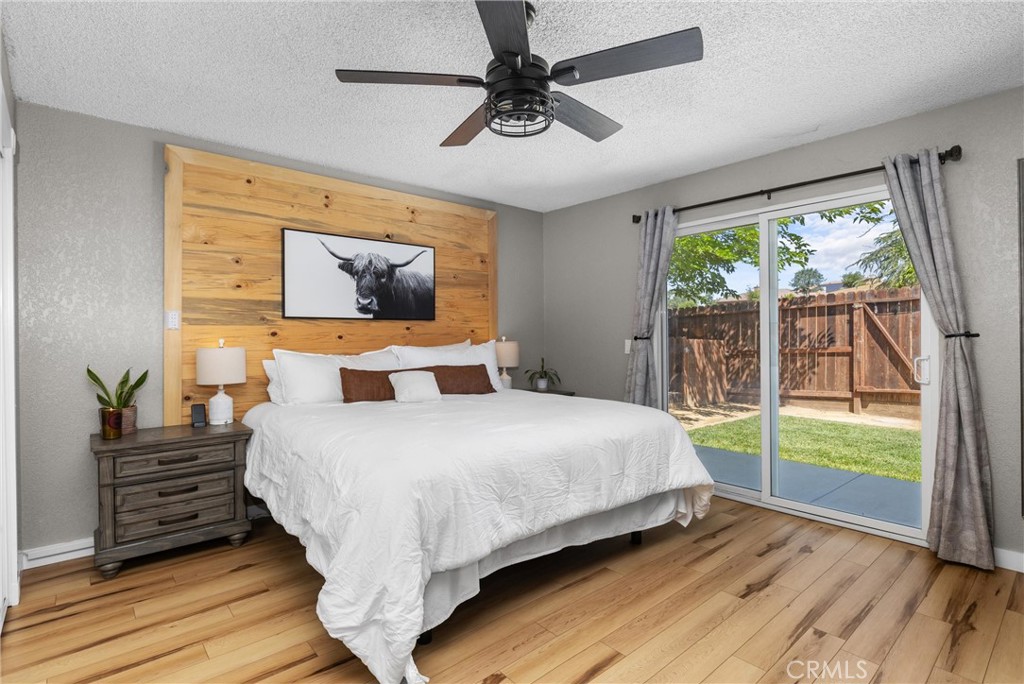 4913 Sparrow Hawk Lane Paso Robles, CA 93446 - Photo 15 of 33 a bedroom with a balcony a bed and a chandelier