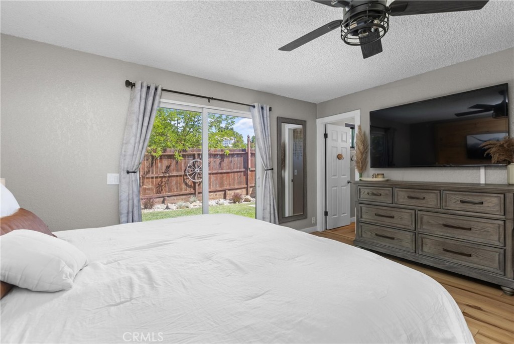 4913 Sparrow Hawk Lane Paso Robles, CA 93446 - Photo 16 of 33 a bedroom with a bed and a flat screen tv