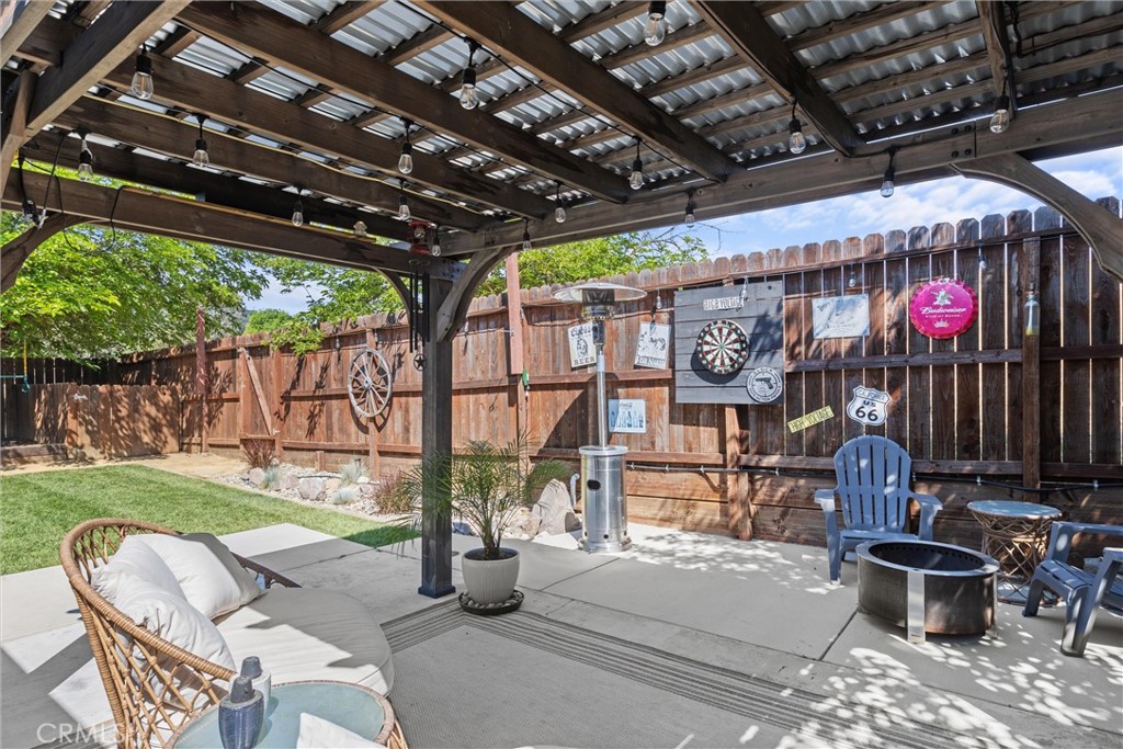 4913 Sparrow Hawk Lane Paso Robles, CA 93446 - Photo 21 of 33 a view of a chairs and tables in patio with a small yard
