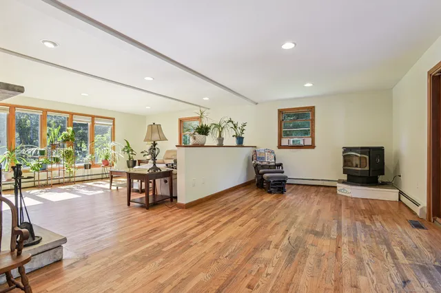 a view of a livingroom with furniture and a flat screen tv