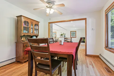 a view of a dining room with furniture window and wooden floor