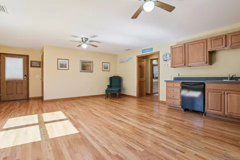 a view of livingroom with hardwood floor and a ceiling fan