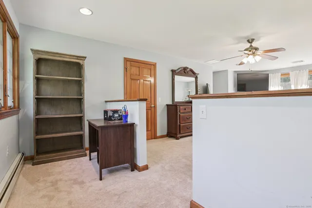 a view of workspace with furniture and window