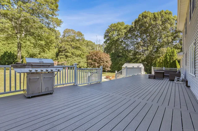 a view of a deck with wooden floor and seating space