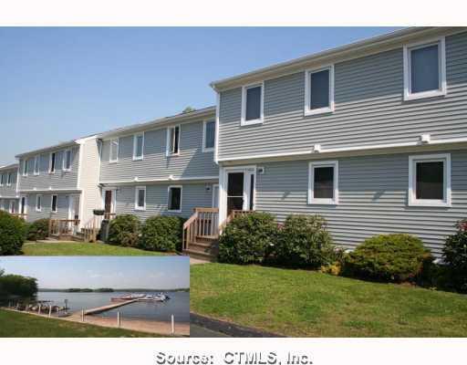 45 Mallard Cove Road, Unit 45 East Hampton, CT 06424 - Photo 1 of 1 a front view of a house with a yard