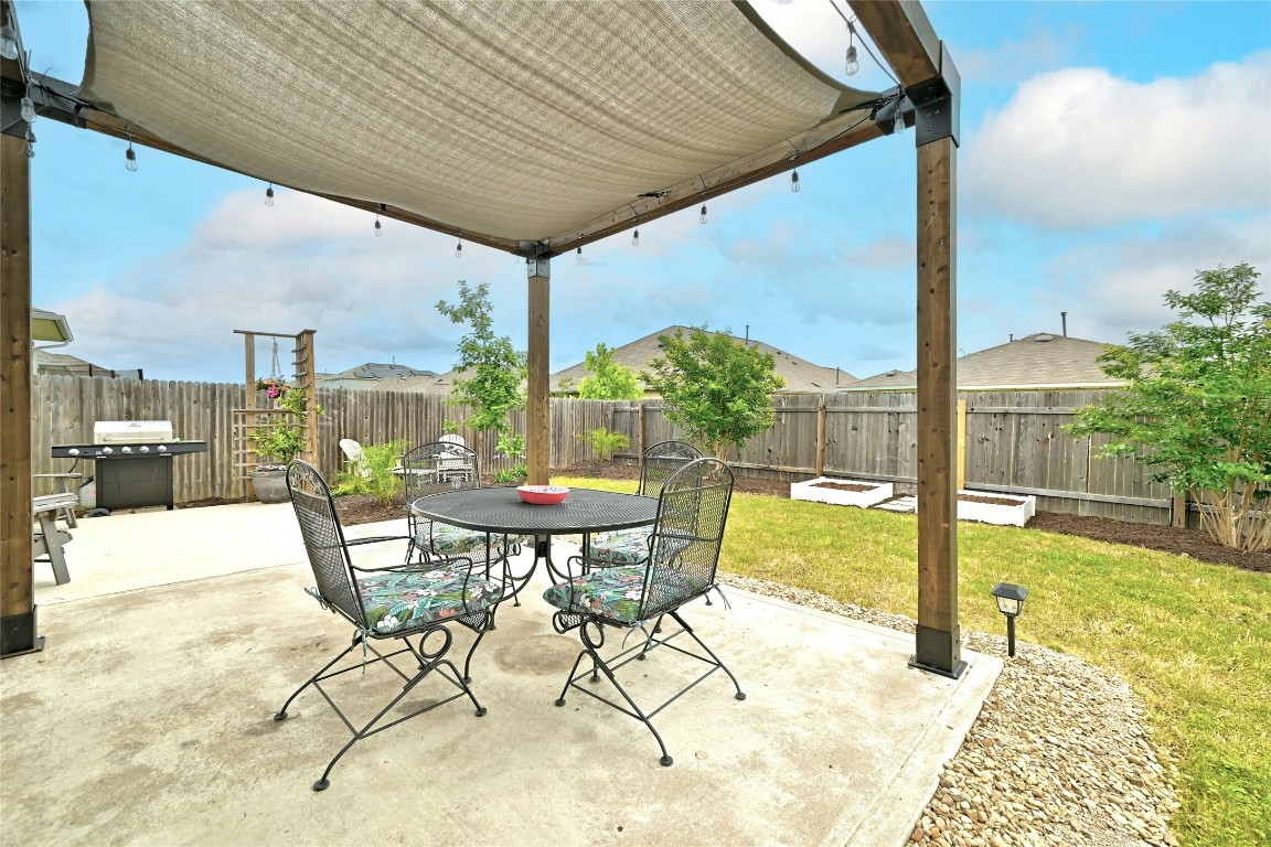 a view of an outdoor dining space with furniture