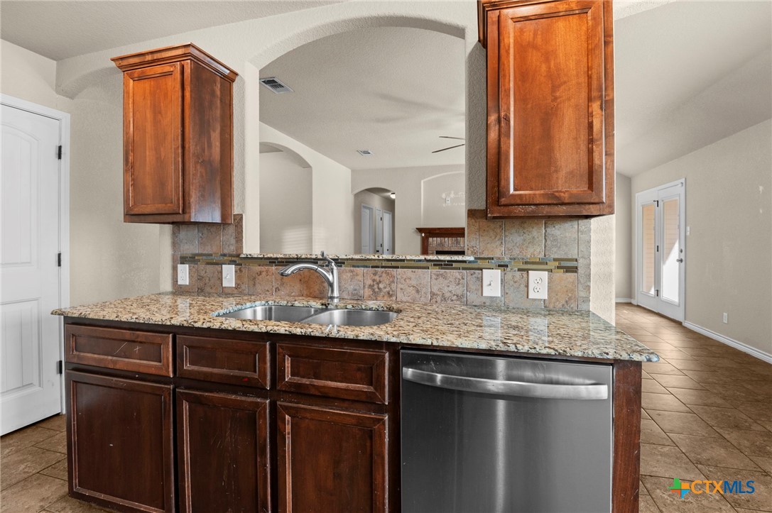 3710 Anvil Range Road Killeen, TX 76549 - Photo 14 of 32 a kitchen with granite countertop a sink and a cabinets