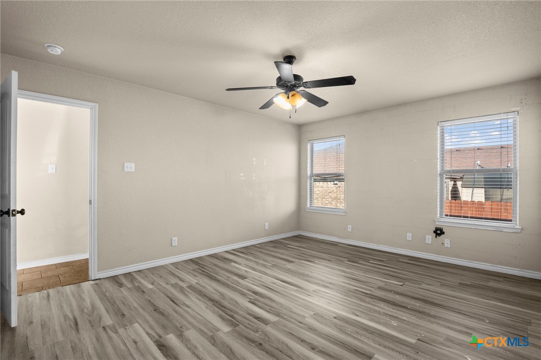 3710 Anvil Range Road Killeen, TX 76549 - Photo 18 of 32 a view of empty room with wooden floor and fan