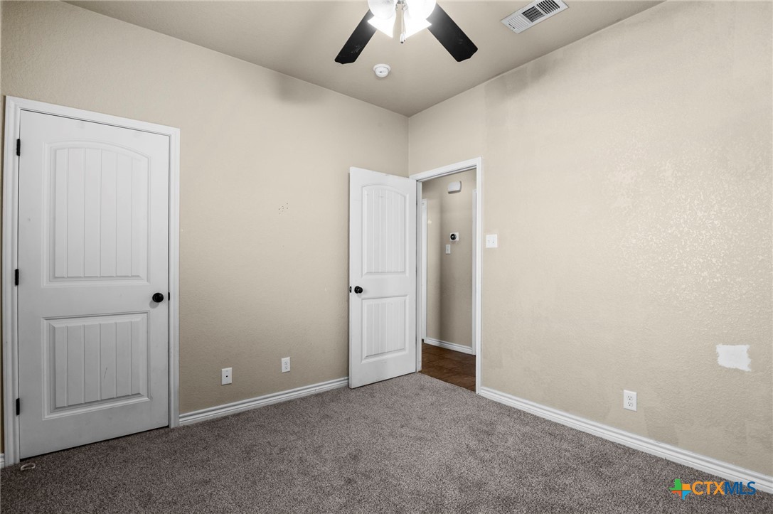 3710 Anvil Range Road Killeen, TX 76549 - Photo 22 of 32 an empty room with a ceiling fan and entryway