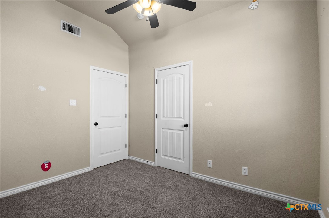 3710 Anvil Range Road Killeen, TX 76549 - Photo 25 of 32 an empty room with chandelier fan and closet