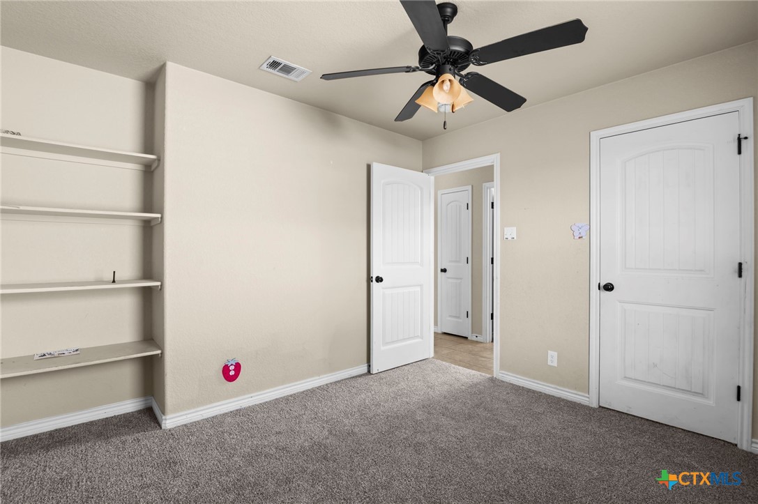 3710 Anvil Range Road Killeen, TX 76549 - Photo 27 of 32 a view of an empty room with a ceiling fan