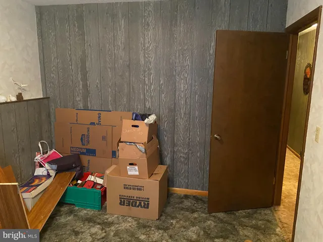 a bathroom with a sink mirror and toilet