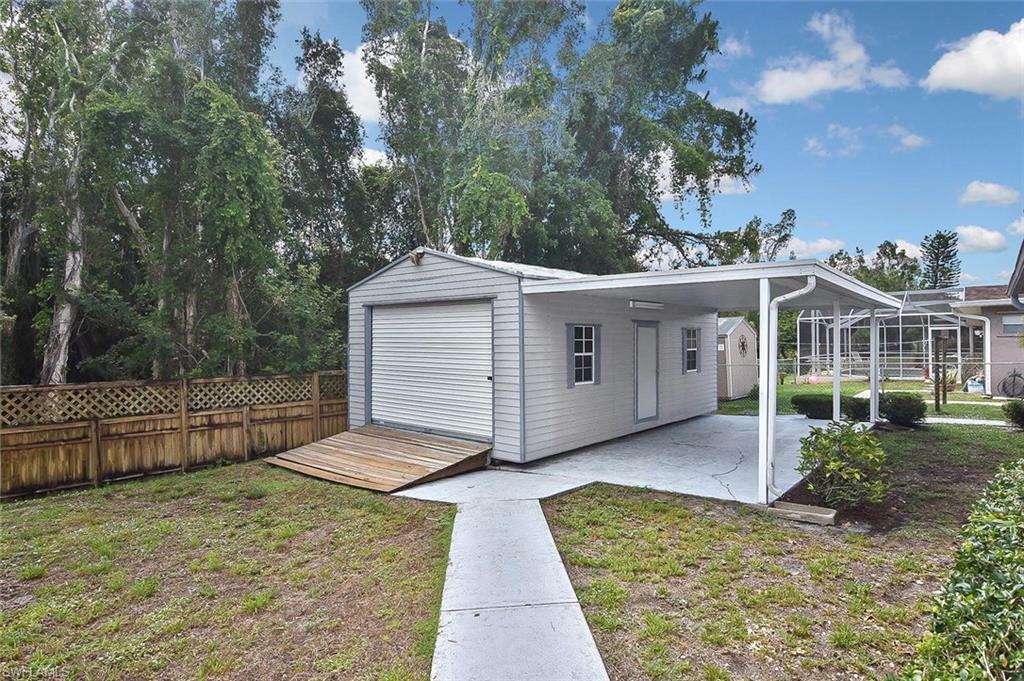 17533 Oriole Road Fort Myers, FL 33967 - Photo 34 of 35 a view of a house with a yard