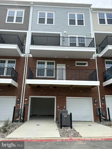 a front view of a house with a garage