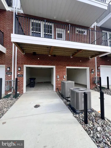 a view of a house with a balcony and front door
