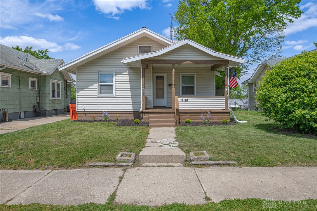 2118 Hillside Avenue Springfield, OH 45503 - Photo 1 of 28 This charming residence features a classic front porch, inviting outdoor enjoyment and curb appeal.