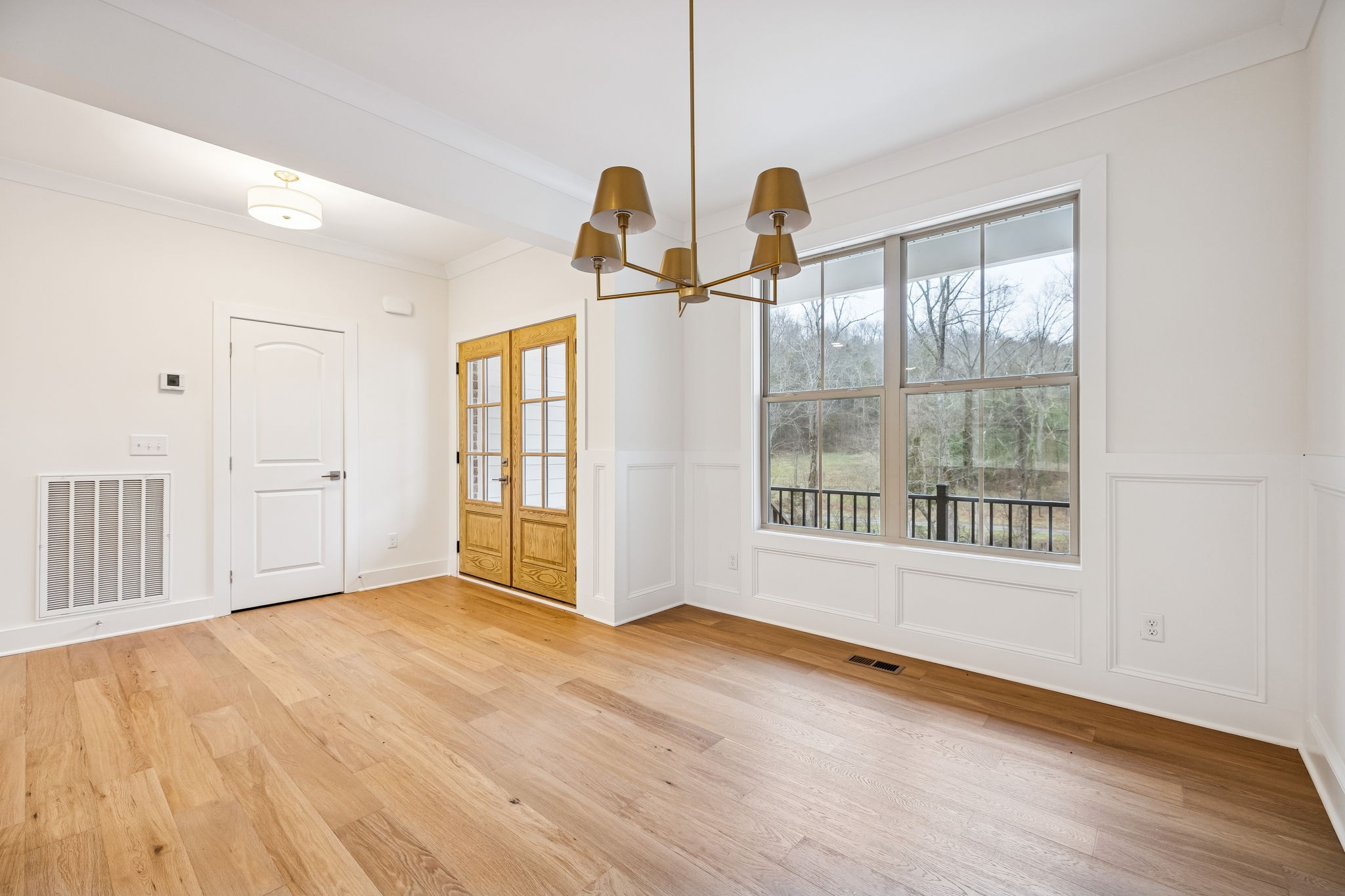 1561 Opossum Paw Road Beechgrove, TN 37018 - Photo 11 of 62 a view of a room with wooden floor and windows
