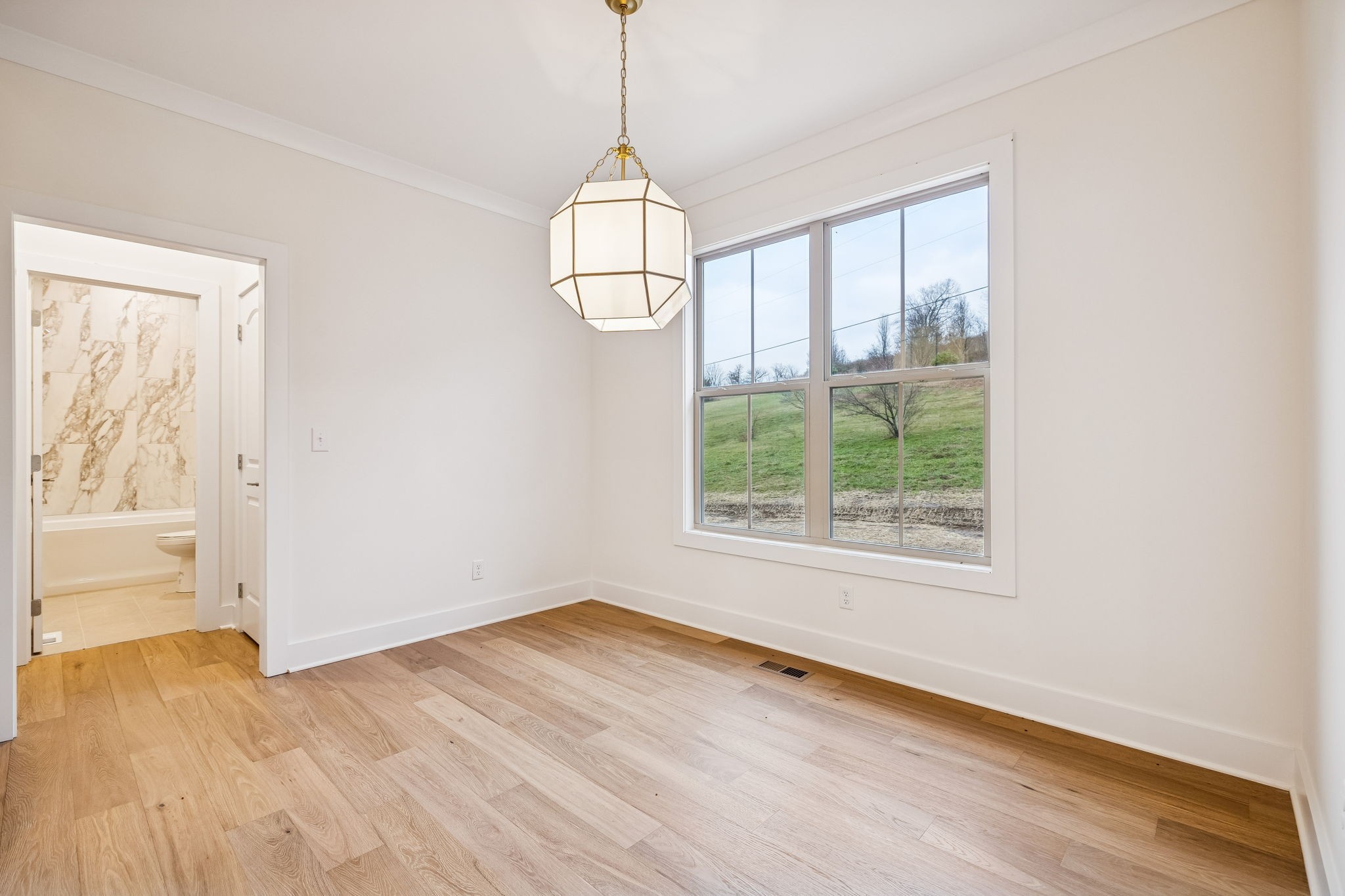 1561 Opossum Paw Road Beechgrove, TN 37018 - Photo 24 of 62 a view of empty room with wooden floor and fan