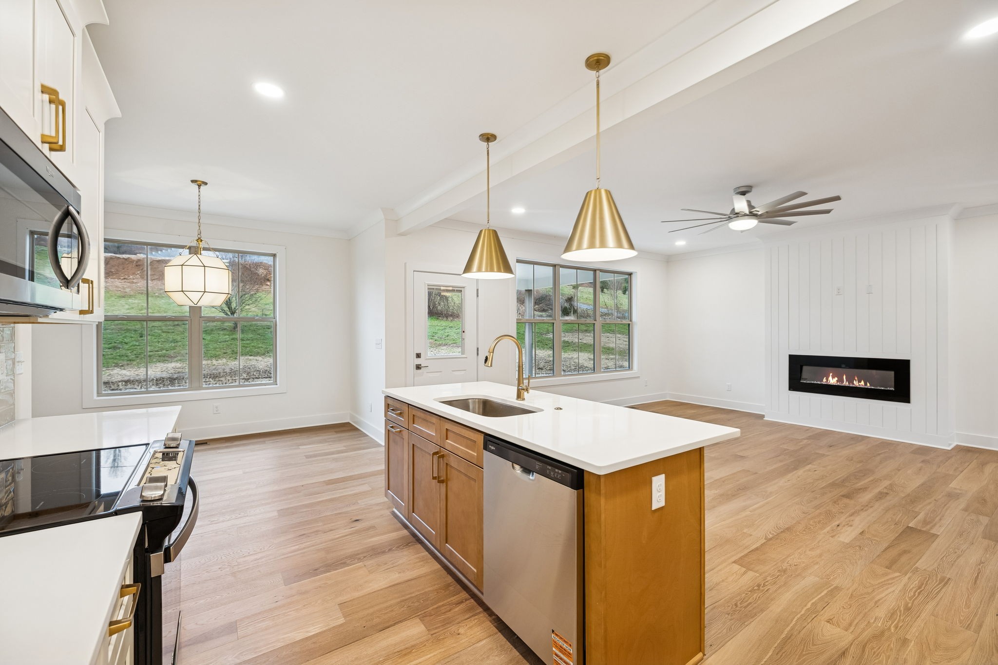 1561 Opossum Paw Road Beechgrove, TN 37018 - Photo 28 of 62 a view of a kitchen with kitchen island a counter top space a sink and appliances