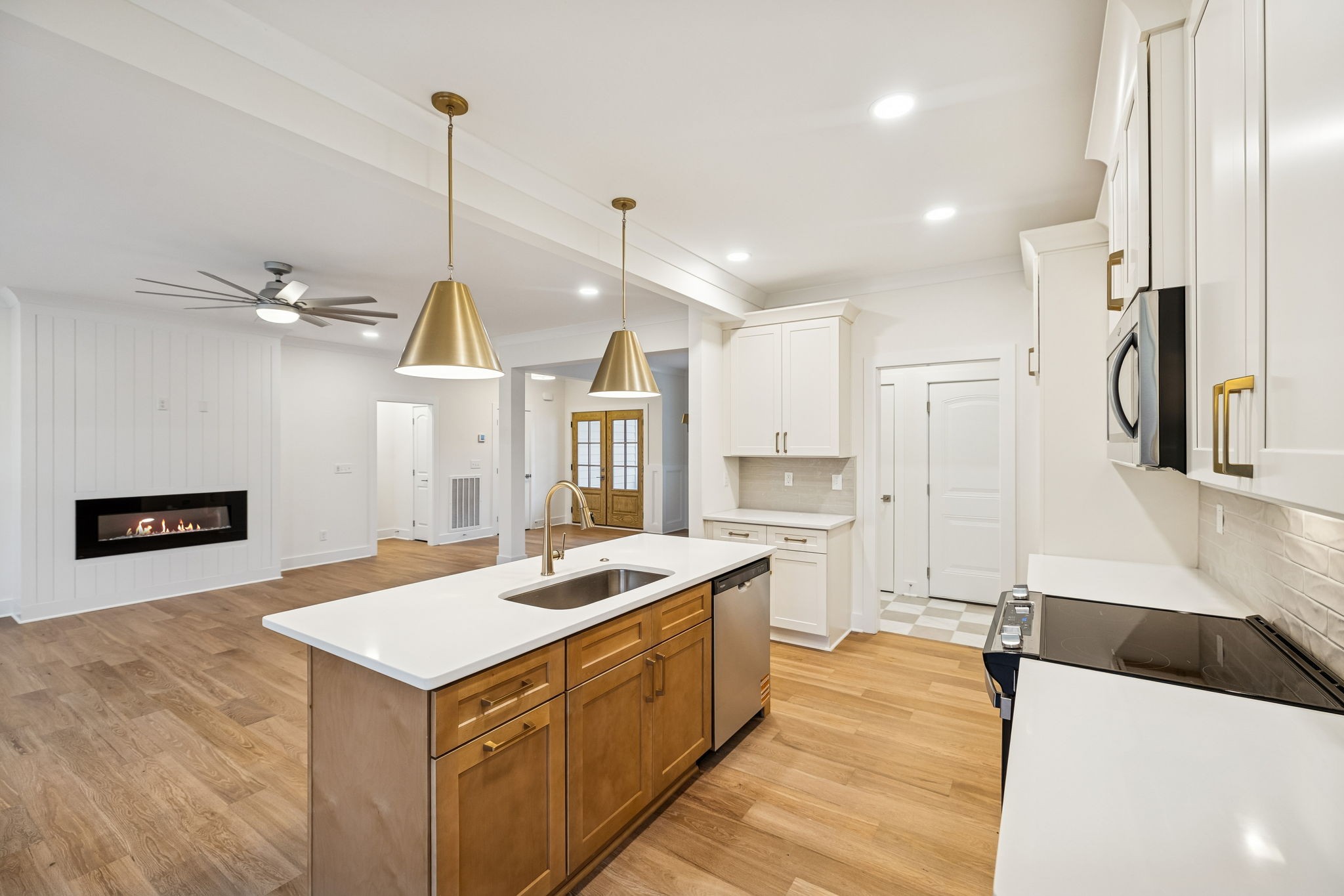 1561 Opossum Paw Road Beechgrove, TN 37018 - Photo 30 of 62 a kitchen with a sink a counter top space stainless steel appliances and a chandelier